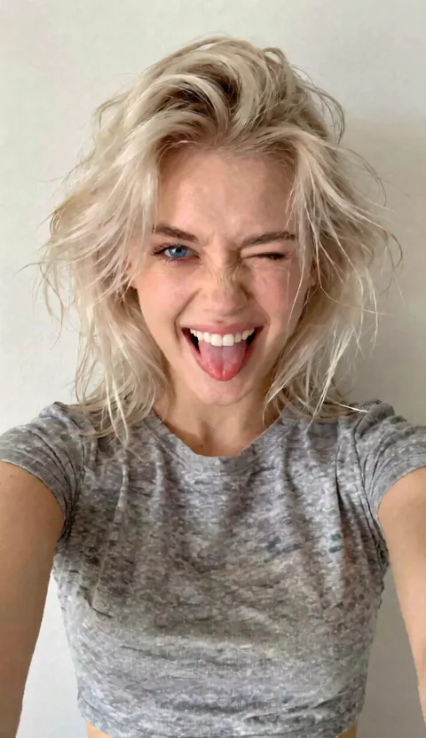 Dylan — Chaotic Fun Best Friend, 22, platinum blonde, vintage band tee, tongue out